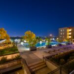 Night view of a luxurious apartment complex with a swimming pool in Westminster, Colorado, USA.