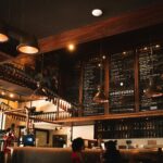 Warm and inviting café interior featuring wooden decor and ambient lighting.