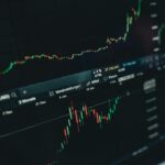 Close-up of a digital market analysis display showing Bitcoin and cryptocurrency price trends.