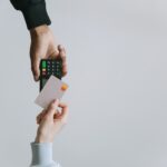 Modern contactless payment using a card and terminal, highlighting the ease of digital transactions.